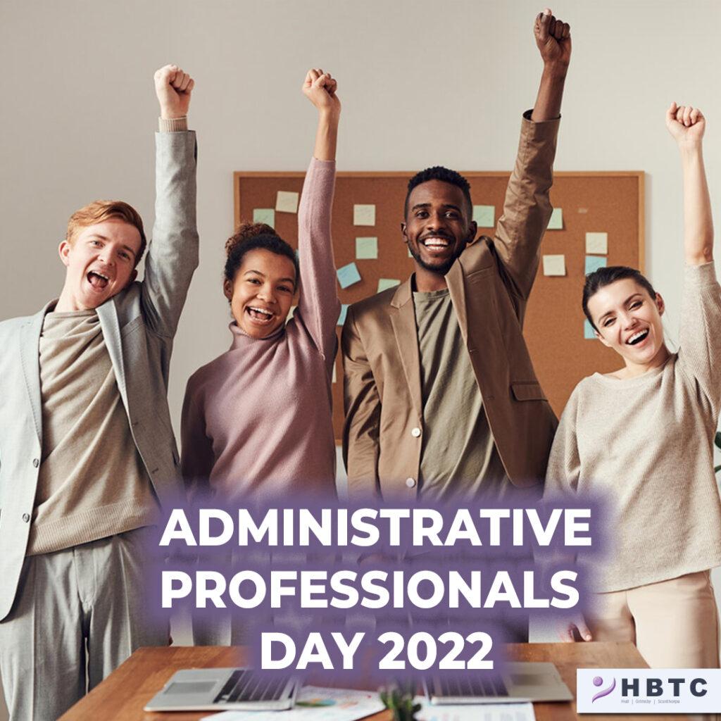 Photo of a diverse group of professional looking people punching the air and looking happy with the words Administrative Professionals Day 2022.