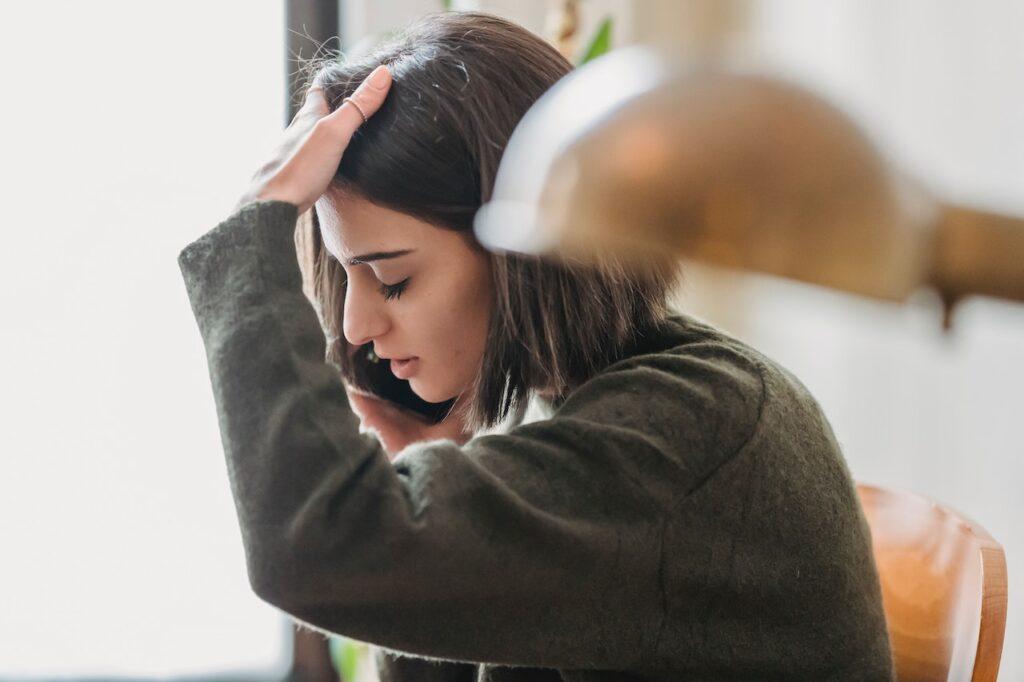 Photo of young woman on the phone. It is important to Recognise Signs of Radicalisation and Extremism in Your Workplace