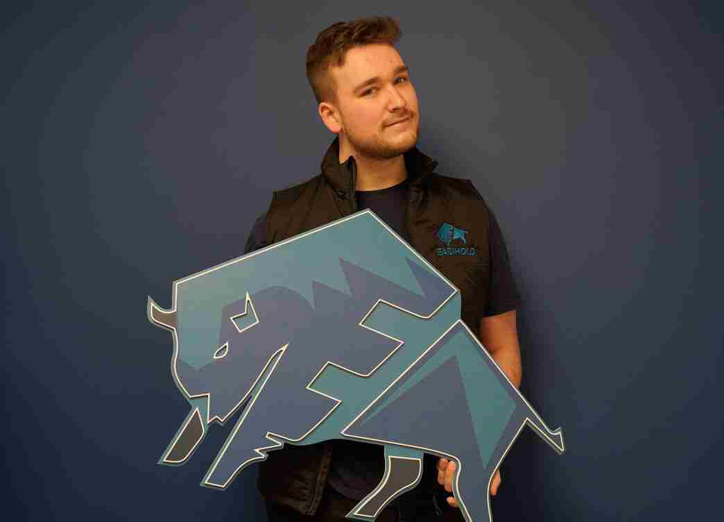 Photo of Zander, who went from a distinction to promotion as an IT & Systems Manager