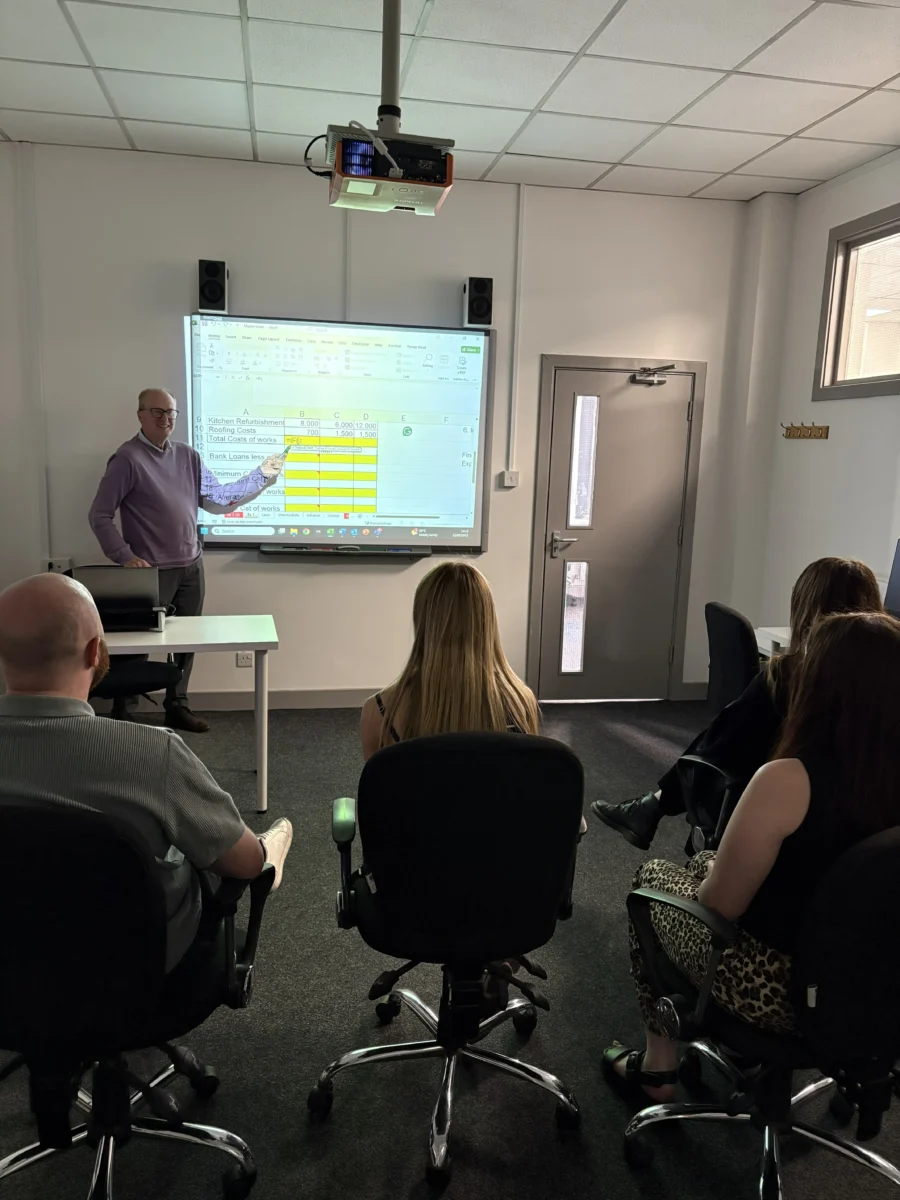 Photo of Richard, our Excel Training tutor, teaching a group of learners an Excel Training Course.