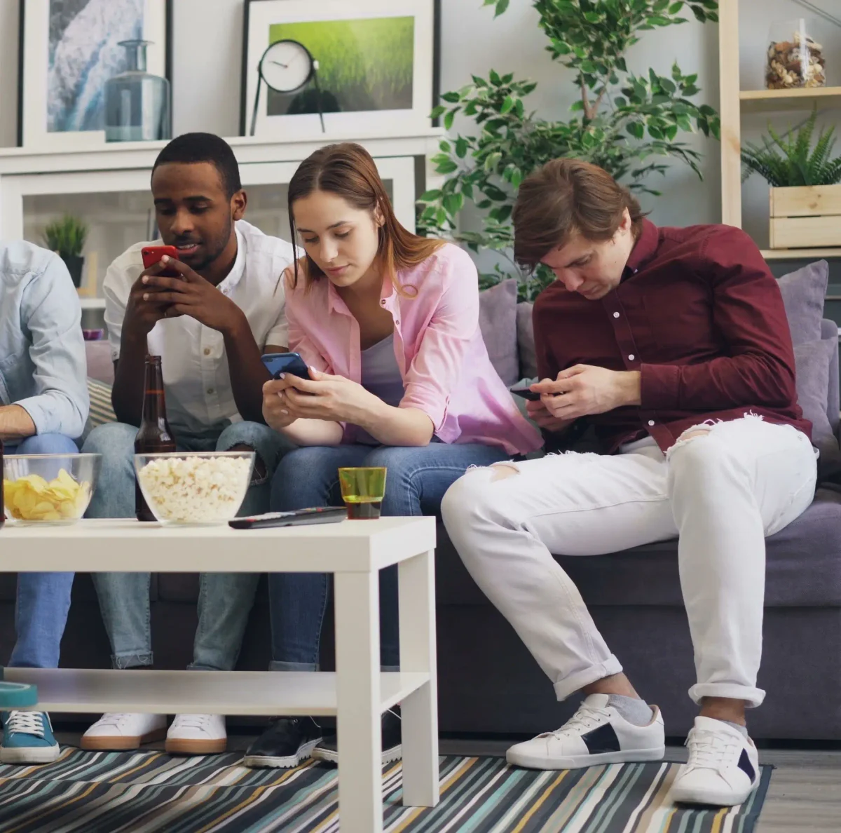 Group of friends scrolling online, all of which will have an algorithm.